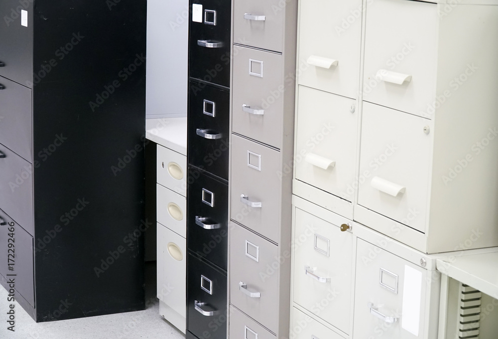 close up on facade view of cabinet and drawers close up on facade view of cabinet and drawers