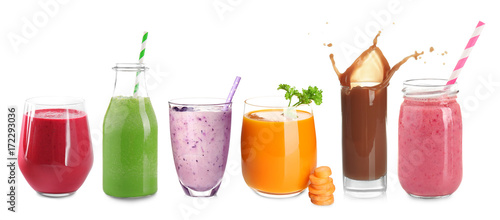 Different protein shakes in glassware on white background