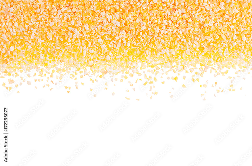 Corn grits groats as decorative border isolated on white background. Top view, closeup.