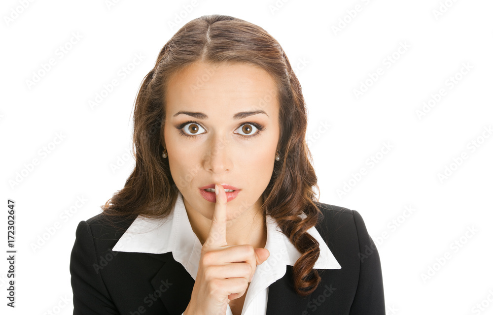 Businesswoman keeping finger on her lips, on white Businesswoman keeping finger on her lips, on white