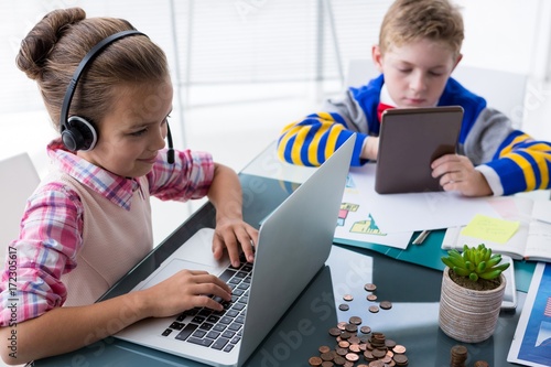 Kids as business executives working together in office photo