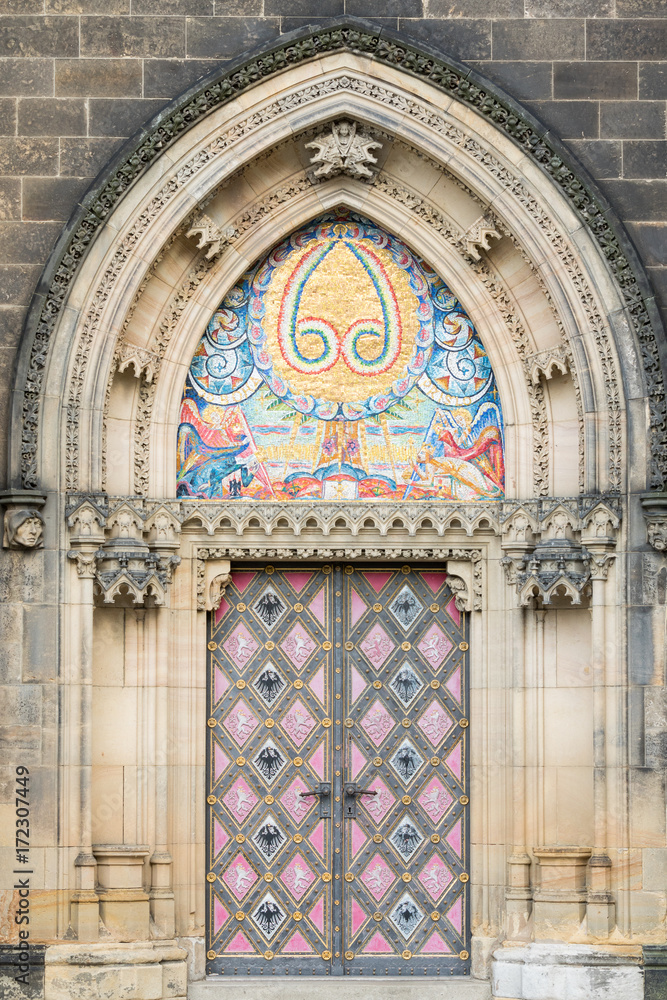 Prague, Czech Republic - August 21, 2017: Colored entrance door
of San Lawrence Basilica
