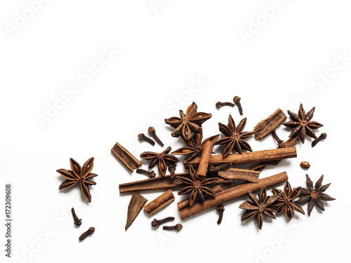 Wallpaper Mural Winter spices background. Cinnamon, cloves and star anise with copy space. Isolated on white with clipping path. Top view or flat lay. Winter food background concept. Torontodigital.ca