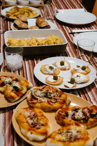 Table at home with pintxos and tapas.