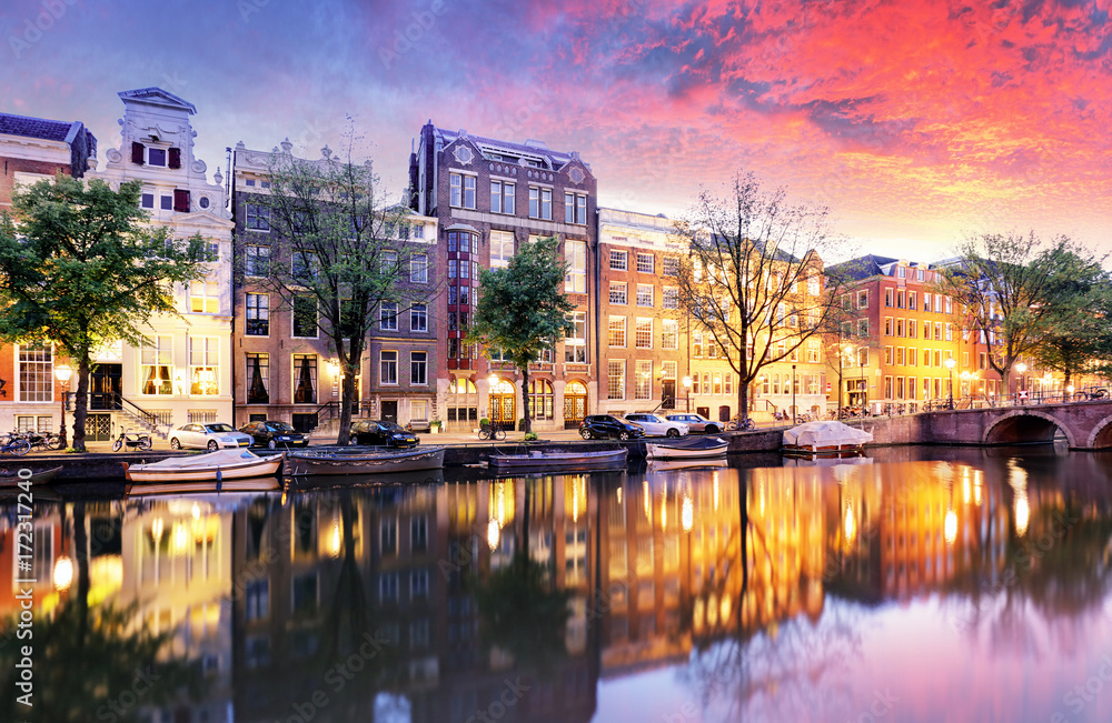 Fototapeta premium Sunset city view of Amsterdam, the Netherlands with Amstel river