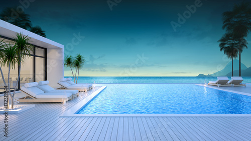 Luxury modern style at the exterior beach houses with a private swimming pool,beach lounge at evening,summer paradise ,Lounge of the breathtaking view sea and sky/3d rendering © LEKSTOCK 3D