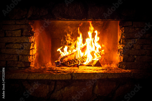 Yellow bright flames in the fireplace