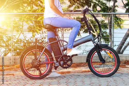Women with electric ebike With lake view