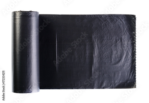 Black plastic polyethylene garbage bag rolled and isolated on white background