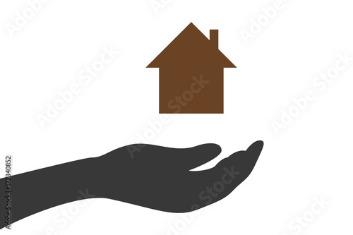 Hand hält Wohnhaus