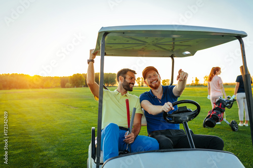 Friends enjoying time on golf course