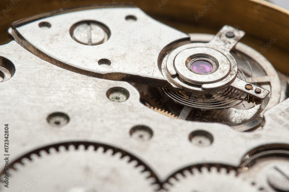 Detail of watch machinery on the table. Detail of watch machinery on the table.