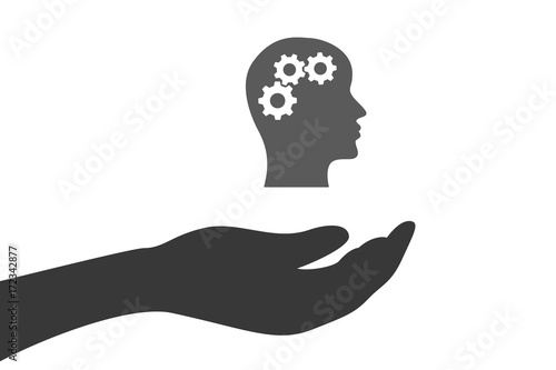 Hand hält Kopf mit Zahnrädern