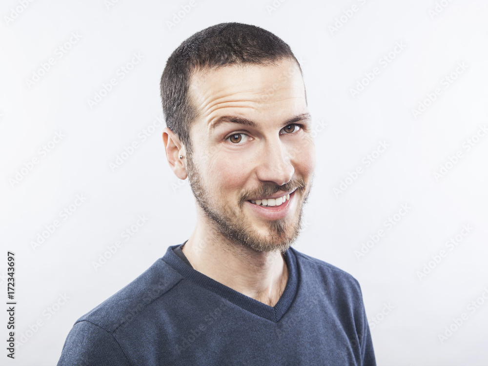 portrait of a young beautiful man smiling, face expression portrait of a young beautiful man smiling, face expression