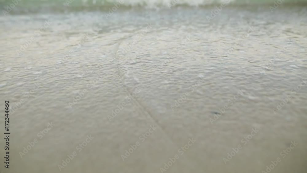 Tidal wave on a clean, sandy, sea beach Tidal wave on a clean, sandy, sea beach