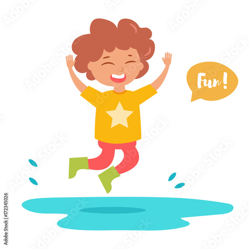 Boy in rubber boots jumping