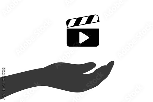 Hand hält Filmklappe