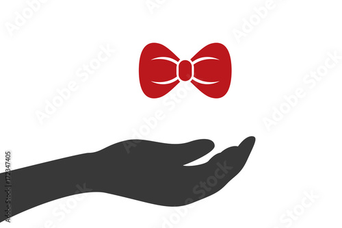 Hand hält Schleife