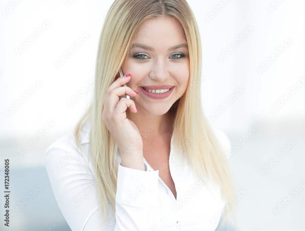 closeup of confident business woman talking on a mobile phone. closeup of confident business woman talking on a mobile phone.