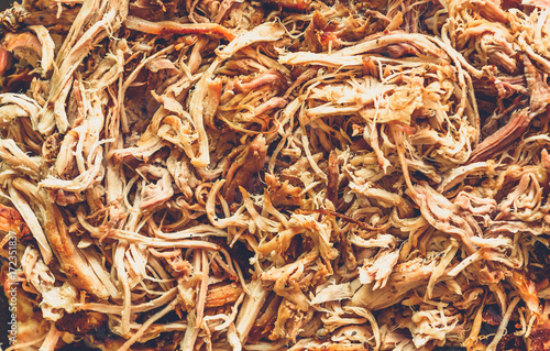 Pulled pork from oven in glass bowl ready for serving.