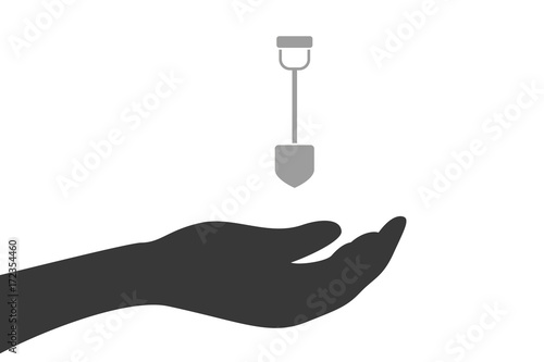 Hand hält Schaufel