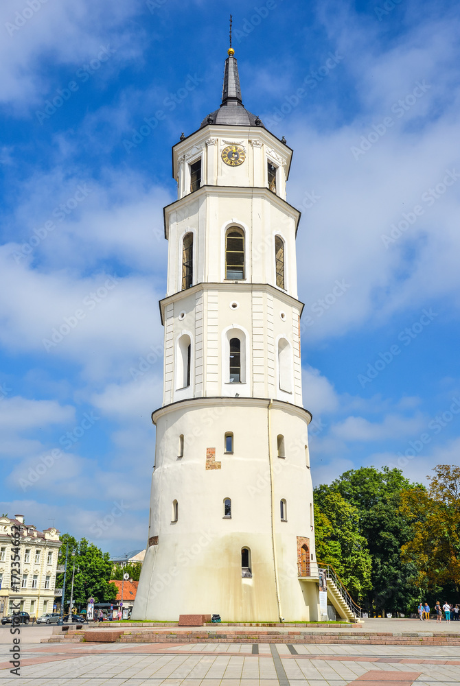 Vilnius, Lithuania - August 13, 2017: Beautiful Belfry and Vilnius Cathedral Basilica of Saints Stanislaus and Vladislaus and bright blue sky with clouds, Vilnius Lithuania. Vilnius old town.