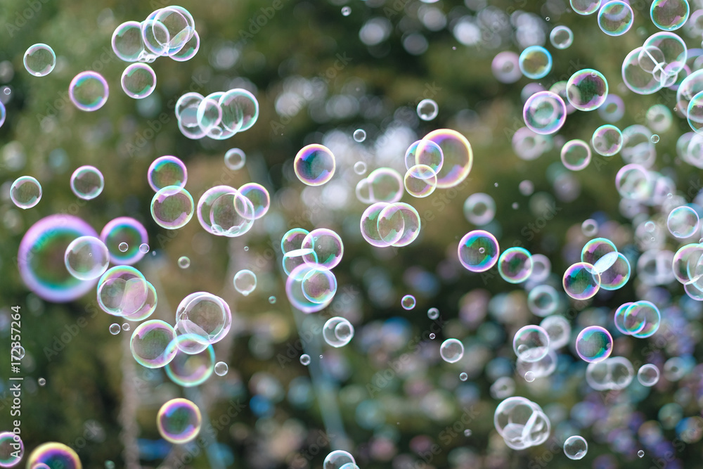 A lot of flying soap bubbles on a city holiday