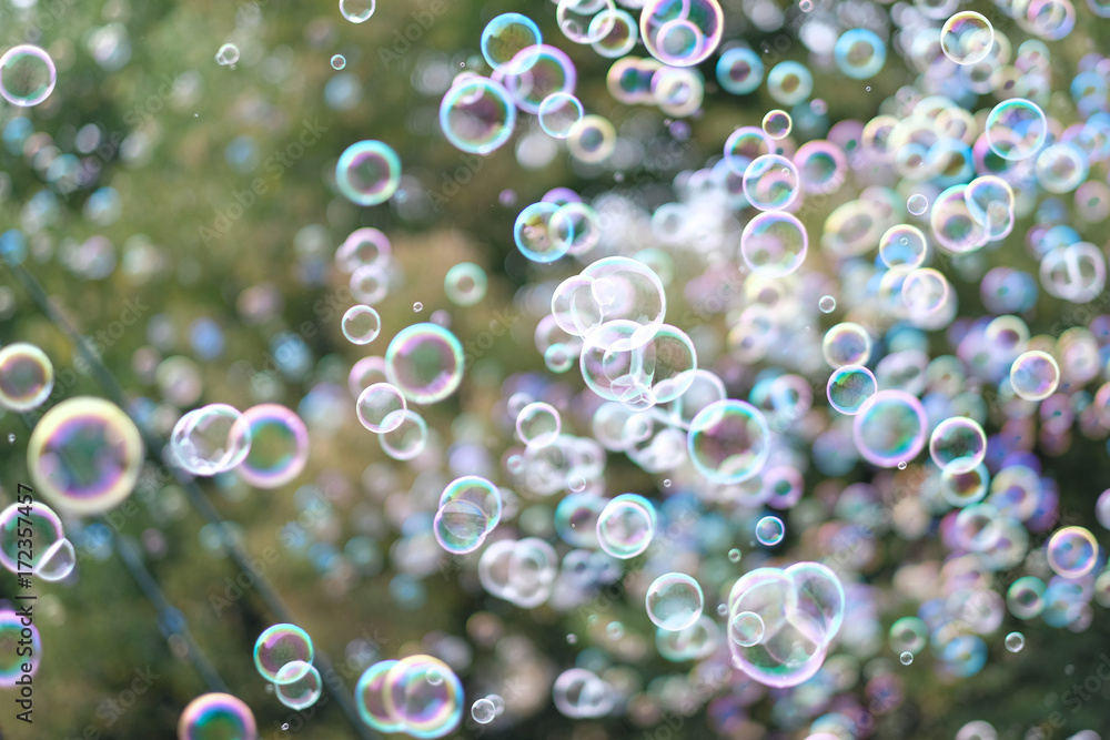A lot of flying soap bubbles on a city holiday A lot of flying soap bubbles on a city holiday