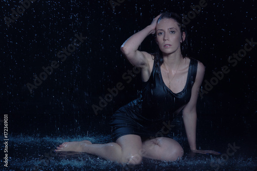 Sexy beautiful woman under rain