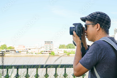 Tourist Stock Photographer Take a photo during Travel around Bangkok Landmark in Thailand