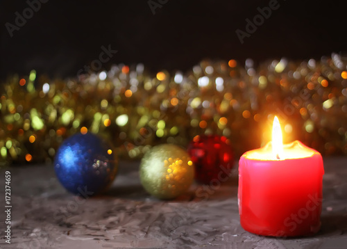 Burning candle on Christmas decoration background.