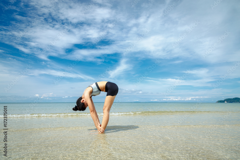 Young woman You are practicing yoga on the beach. Young woman You are practicing yoga on the beach.