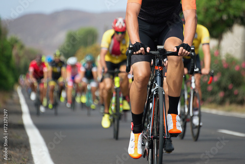 Fototapeta Naklejka Na Ścianę i Meble -  Cycling competition,cyclist athletes riding a race at high speed