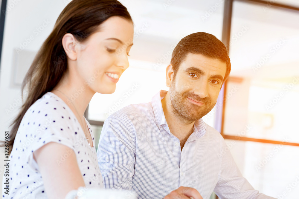 Image of two young business people in office Image of two young business people in office