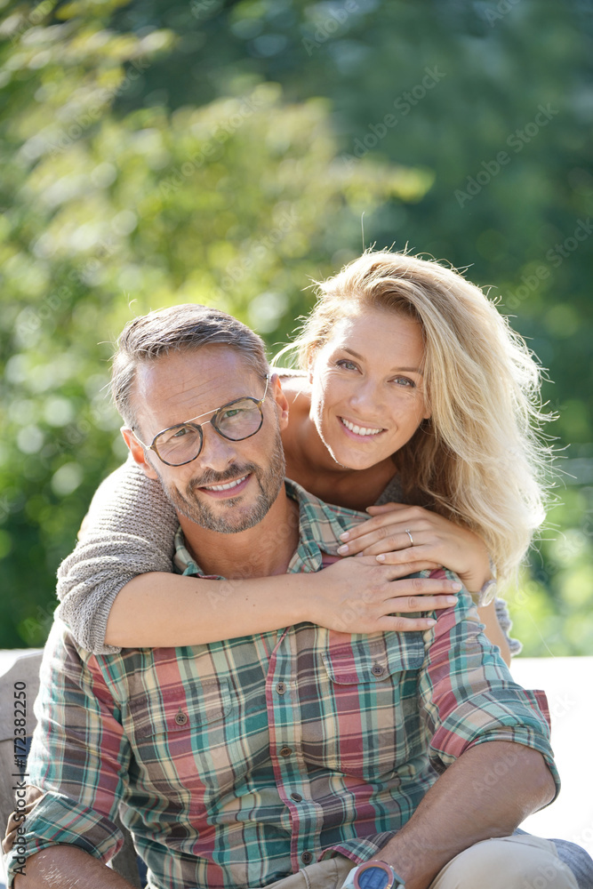 Portrait of mature couple enjoying sunny day in nature Portrait of mature couple enjoying sunny day in nature