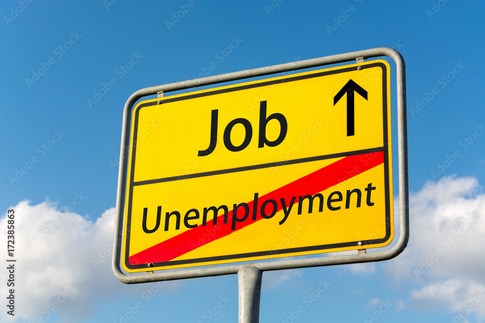 Yellow street sign with job ahead leaving unemployment behind Yellow street sign with job ahead leaving unemployment behind