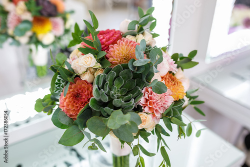 Fototapeta Naklejka Na Ścianę i Meble -  bright wedding bouquet of summer dahlias and roses