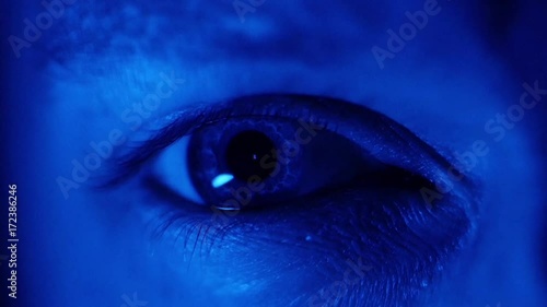 Pupil Dilating, Eye Blue Neon Glow, Close Up  photo