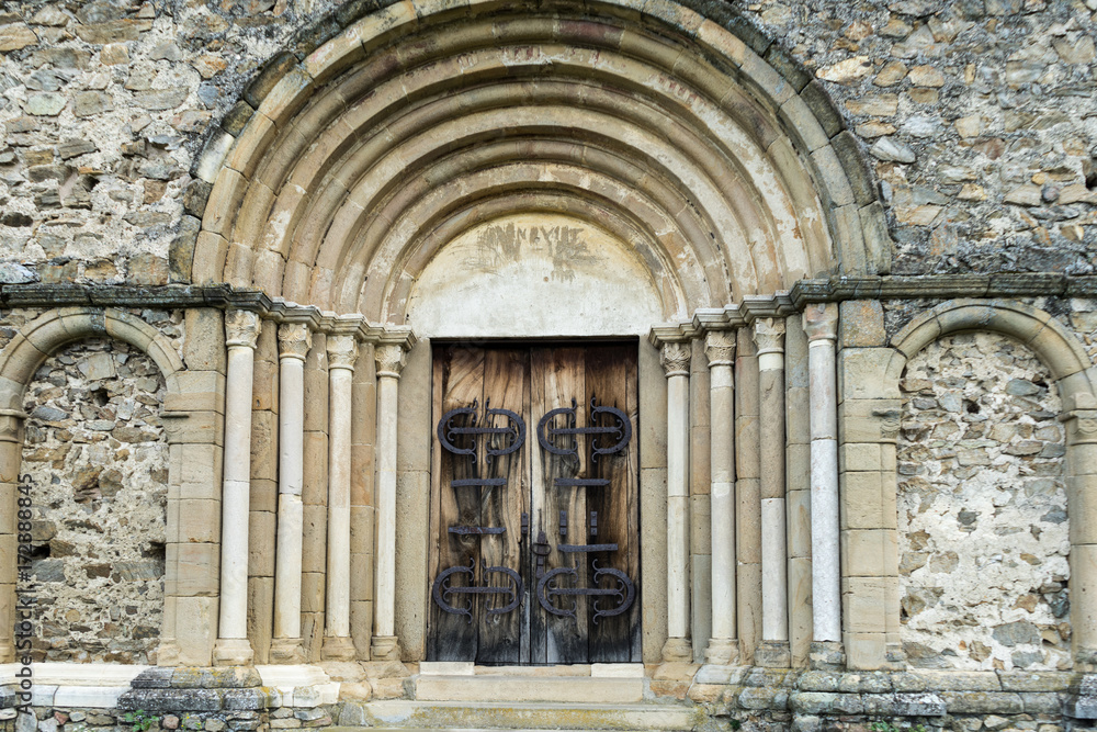 Main door of Cisnadioara fortified church, medieval fortress on the hill near Sibiu, Transylvania, Romania
