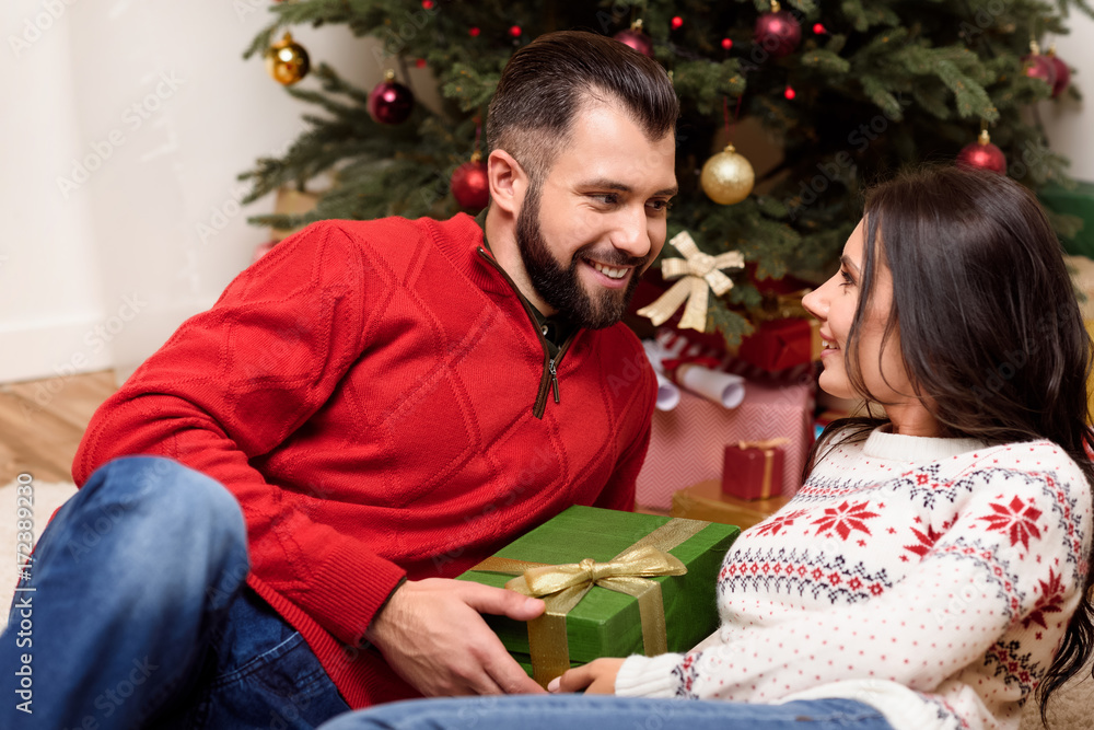 couple with christmas present couple with christmas present