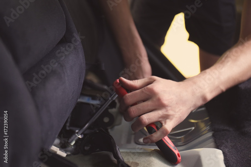 Auto mechanic fixing car in repair shop © Africa Studio