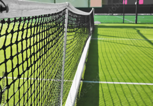 Tennis net on court in sunny day © Africa Studio