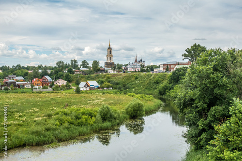 Image of picturesque pesage, wooden houses, church,