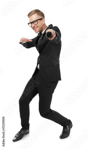 Cuadro en lienzo Young presenter with microphone on white background