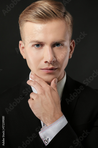 Portrait of young man in su...