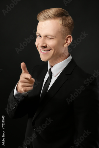 Portrait of young man in su...