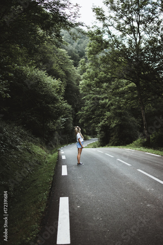 Wallpaper Mural Woman walking on rod in woods Torontodigital.ca