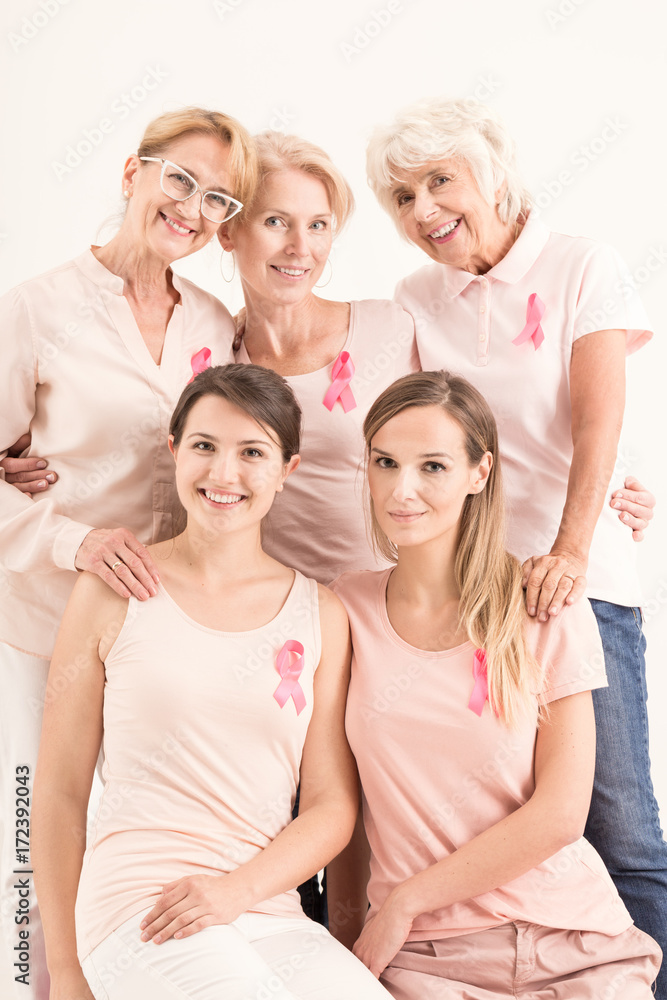 Women in pink shirts and pink ribbons Women in pink shirts and pink ribbons