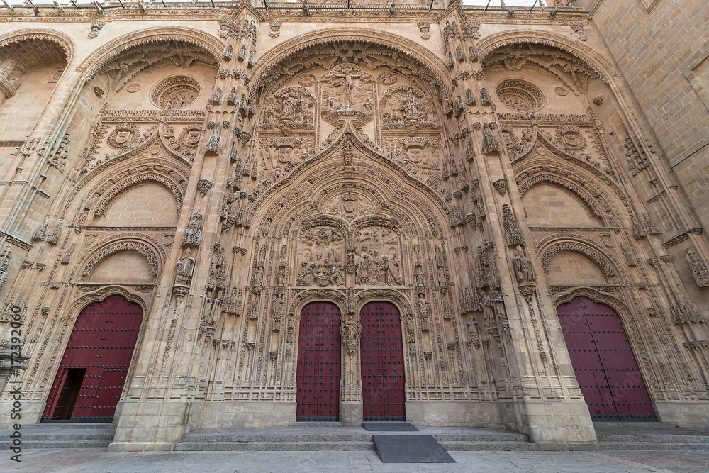 Main facade of Salamanca New Cathedral with red doors, Community of Castile and León, Spain.  Declared a World Heritage Site in 1988