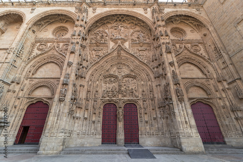 Main facade of Salamanca New Cathedral with red doors, Community of Castile and León, Spain. Declared a World Heritage Site in 1988
